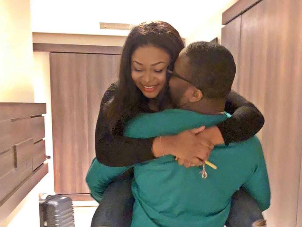 Ruth kadiri's husband in a loved up position with her