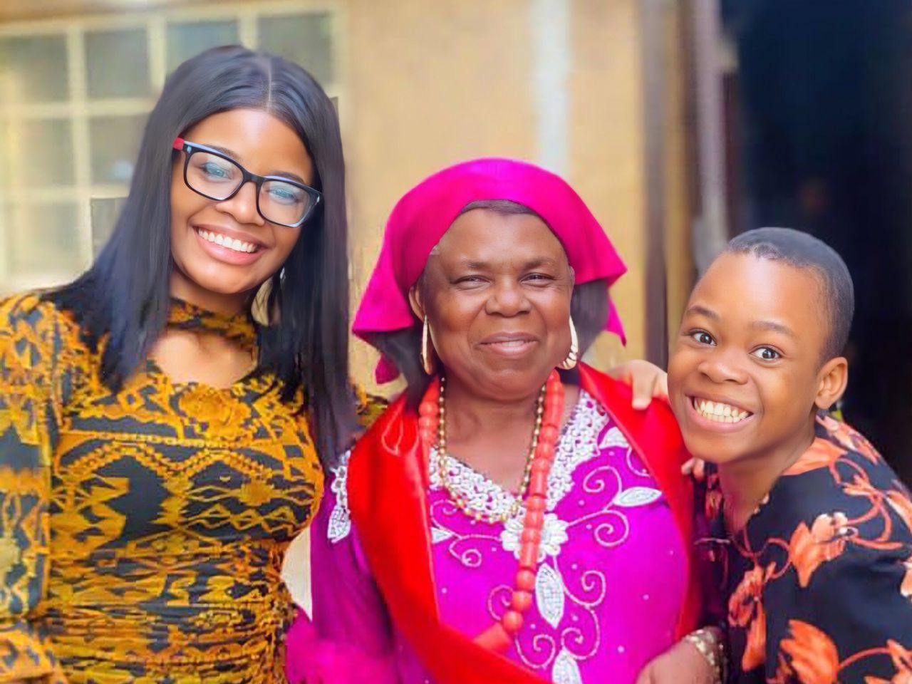 Anibueze Chinenye Eucharia from the right, her grandmother and younger sibling