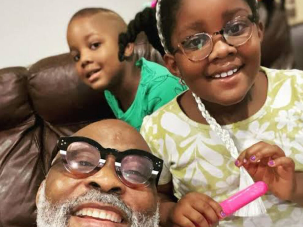 RMD poses with his grandchildren.